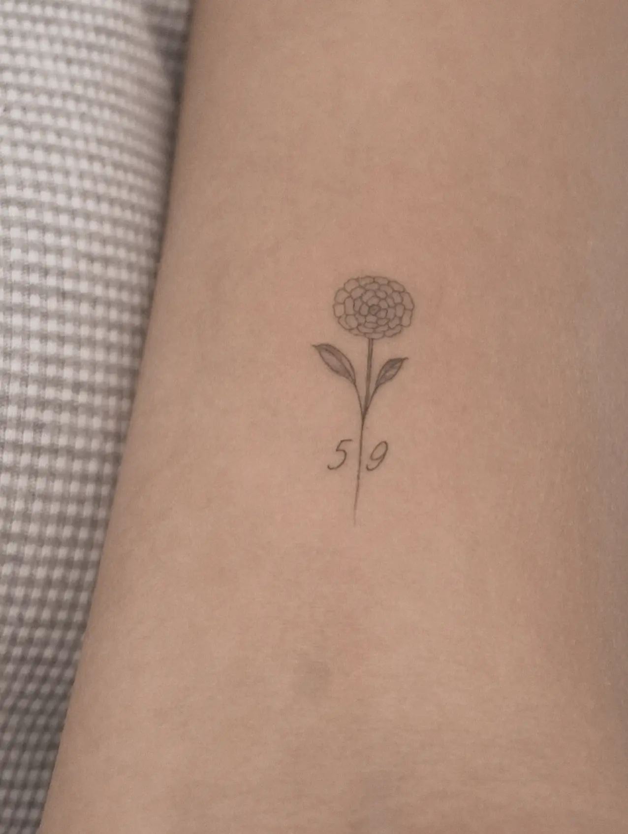 sunflower fine line tattoo